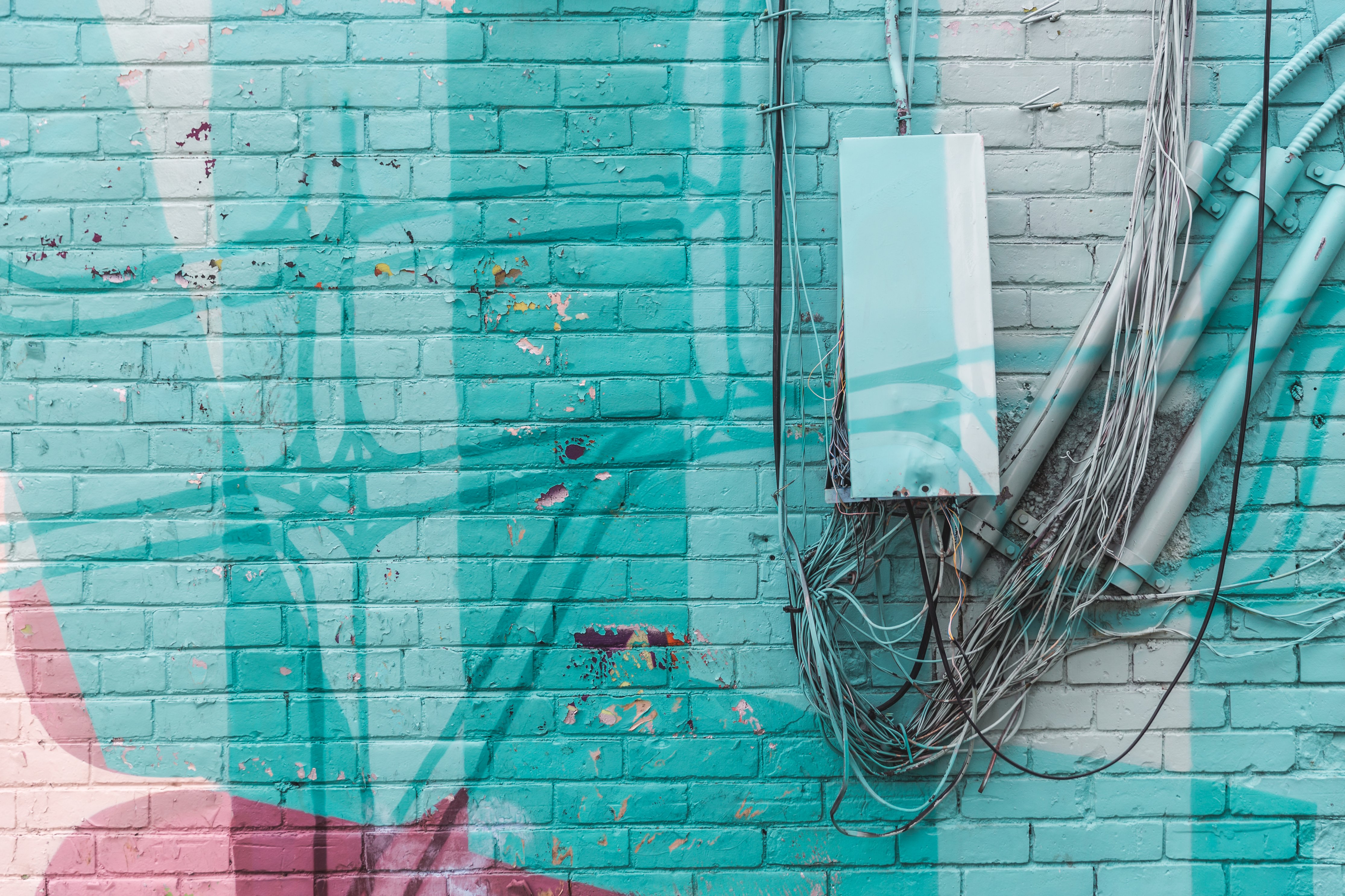 turquoise-brick-wall-with-wires_4460x4460_Photo by Matthew Henry from Burst